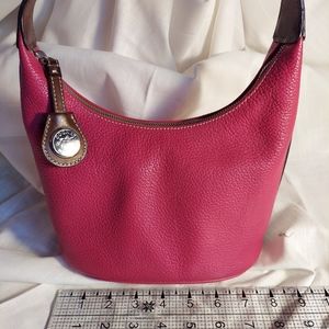Bright pink Dooney and Bourke bag